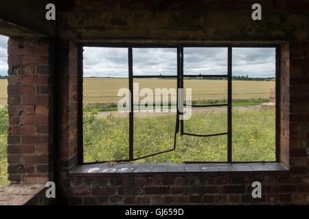 Derelict control tower at RAF Coleby Grange, Lincolnshire. The air field was used during World War 2 and the Cold War. Stock Photo