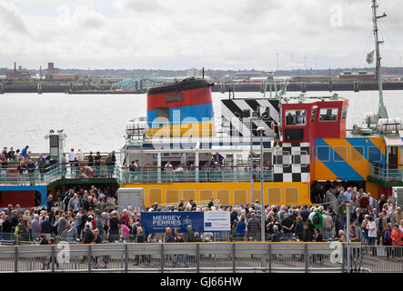 Summer season crowds on the Dazzle River Mersey Ferry, a European Union Development Fund project,  at the Pierhead, Waterfront, Liverpool, Merseyside, UK Stock Photo