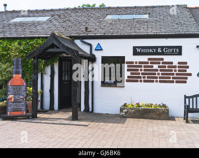 dh Blacksmiths shop Scotland GRETNA GREEN DUMFRIES Whisky gift shop welcome in different languages tourism souvenir shops uk Stock Photo