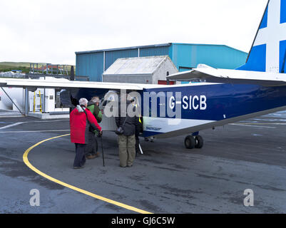 dh Tingwall SHETLAND SCOTLAND People boarding Direct flights islander aircraft for Fair Isle plane