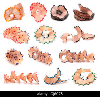 Set of shavings from green, red, blue, black, violet pencils, isolated on white background. Stock Photo