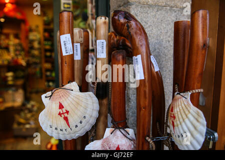 Pilgrim staff's, walking sticks for sale at this tourist shop in the Old Town of Santiago de Compestela. The scallop shell is th Stock Photo