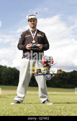 Drone Racing Queen's Cup 2016.  FPV, First Person View Drone racer pilot Gary Kent flies a quadcopter drone at the flightline. Stock Photo
