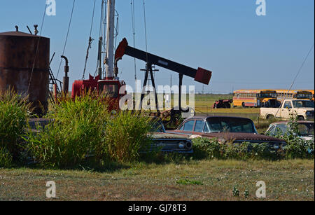 Old cars sit abandoned in a field under the West Texas sun off of Texas Highway 60 outside Pampa. Stock Photo