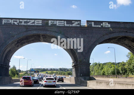 Heavy traffic on the M25 motorway anticlockwise looking south between junctions 15 and 16, near Heathrow Airport in England Stock Photo