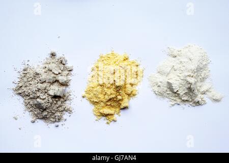 Three different types of flour on white background Stock Photo