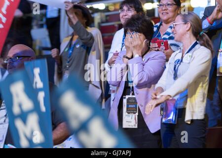 Hillary Rodham Clinton supporters cheer as she addresses delegates via live video link on the day they chose her as the Democratic Presidential nominee on the 2nd day of the Democratic National Convention at the Wells Fargo Center July 26, 2016 in Philadelphia, Pennsylvania. Stock Photo