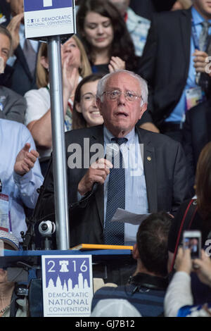 Senator Bernie Sanders throws his support behind Democratic presidential nominee Hillary Rodham Clinton from the Vermont delegation during roll call on the 2nd day of the Democratic National Convention at the Wells Fargo Center July 26, 2016 in Philadelphia, Pennsylvania. Stock Photo