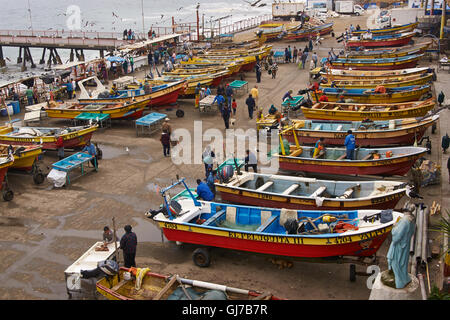 Colourful wooden fishing boats in the fish market of the UNESCO World Heritage port city of Valparaiso in Chile. Stock Photo