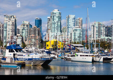 Marina in False Creek with the skyline of the Yaletown district of Vancouver as a backdrop Stock Photo