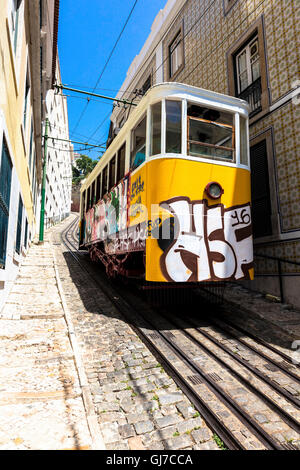 Funicular streetcar in the city of Lisbon, covered up in graffiti in July 2016. Stock Photo