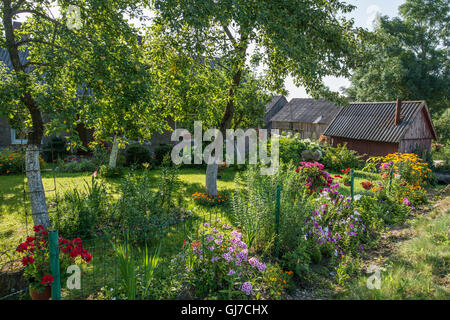Country house with flowering garden in Lithuania Stock Photo