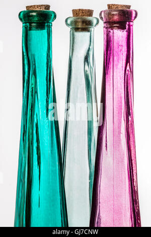 Colored glass bottles Cutouts on Light table. Stock Photo