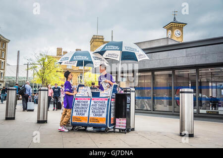 Evening Standard news stand outside Kings Cross Station, King's Cross Square, London, England, U.K. Stock Photo