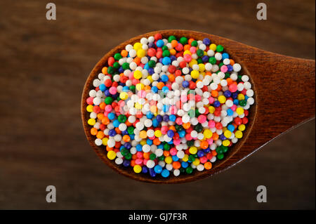 sweet sugar spreading pastry in wooden spoon Stock Photo