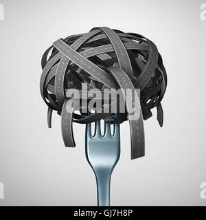 Food Transport or eating on the road concept as a fork inside a pile of twisted streets and highways shaped as pasta or spaghetti as a transportation symbol for shipping or delivering a meal as a 3D illustration. Stock Photo