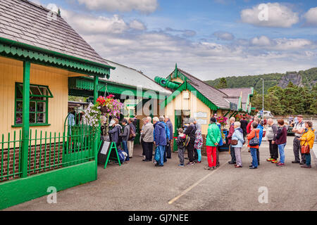 Queue of people in outdoor gear at Llanberis Station, waiting for the Snowdon Mountain Railway, Llanberis, Snowdonia National... Stock Photo