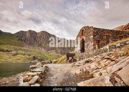 Ruined buildings of the Britannia Copper Mine, on the Miners' Track beside Llyn Llydaw in the Snowdonia National Park, Gwynedd, Stock Photo