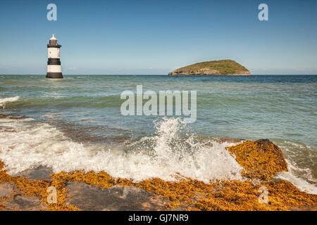 Penmon Lighthouse and Puffin Island, off Penmon Point, at the east end of the Menai Strait, Anglesey, Wales, UK. Stock Photo
