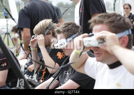 Drone Racing Queen's Cup 2016.  Drone racer pilots at the flightline prepare for flight prior to racing. Stock Photo