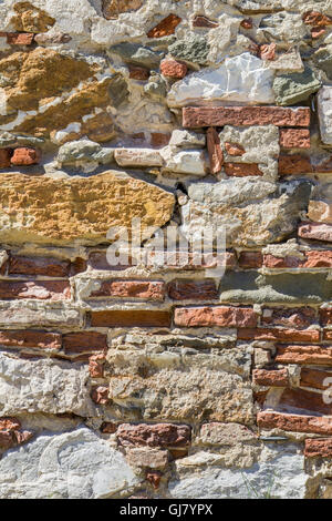 Exposed bricks through the plaster on a deserted farmhouse in Pisa Stock Photo