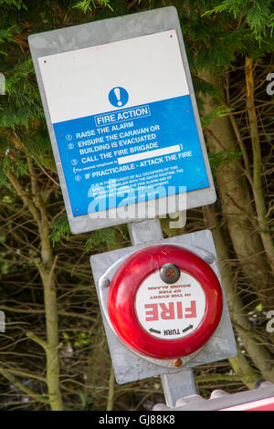 Old Fashioned Fire Alarm Warning Bell with Fire Action Notice Stock Photo