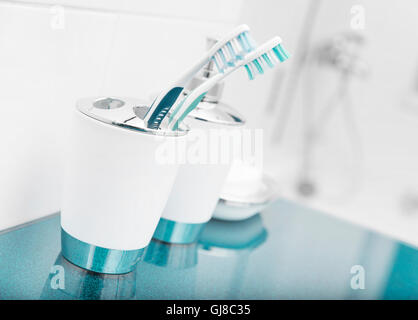 Personal hygiene items. Accessories in white bathroom. Stock Photo
