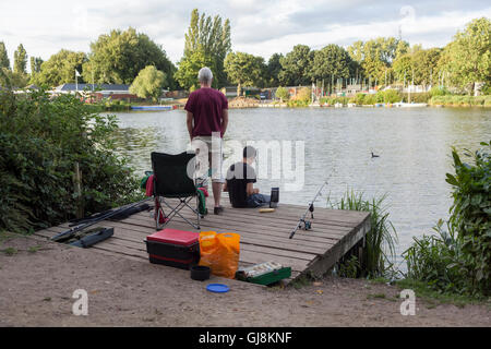 WELWYN GARDEN CITY, UK. 13th Aug, 2016. Two men fishing on the bank of Stanbrough lake on a bright summer's day. Credit:  Robert Norris/ Alamy Live News Stock Photo