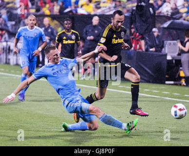 Columbus, U.S.A. 13th Aug, 2016. August 13, 2016:New York City FC defender Frederic Brillant (13) tackles the ball away from Columbus Crew SC forward Justin Meram (9) in the first half. Columbus, OH, USA. (Brent Clark/Alamy Live News) Stock Photo