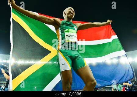 RIO DE JANEIRO, BRAZIL - AUGUST 13: Luvo Manyonga of South Africa hold the South African national flag high after wining the silver medal in the mens long jump final during the evening session on Day 8 Athletics of the 2016 Rio Olympics at Olympic Stadium on August 13, 2016 in Rio de Janeiro, Brazil. (Photo by Roger Sedres/Gallo Images) Credit:  Roger Sedres/Alamy Live News Stock Photo