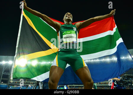 RIO DE JANEIRO, BRAZIL - AUGUST 13: Luvo Manyonga of South Africa hold the South African national flag high after wining the silver medal in the mens long jump final during the evening session on Day 8 Athletics of the 2016 Rio Olympics at Olympic Stadium on August 13, 2016 in Rio de Janeiro, Brazil. (Photo by Roger Sedres/Gallo Images) Credit:  Roger Sedres/Alamy Live News Stock Photo