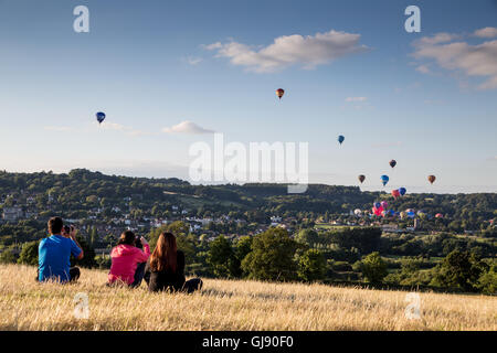 Bristol, UK. 14th Aug, 2016. The final day of the balloon fiesta festival sees the mass ascent of many colourful balloons from the Ashton Court Estate in Bristol. The weather conditions were perfect as the sun beamed onto the countryside. The light winds took the drifting balloons South Westerly away from the city. Credit:  Wayne Farrell/Alamy Live News Stock Photo