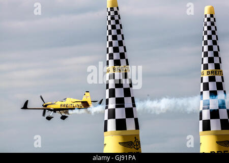 A pilot Nigel Lamb from United Kingdom races in his Breitling plane at the Masters Cup air race at the Red Bull Air Race 2016 in Ascot Stadium, UK on the 14.08.2016. The final winner was Matt Hall from Australia, second Matthias Dolderer from Germany, and the third Hannes Arch from Austria. Stock Photo