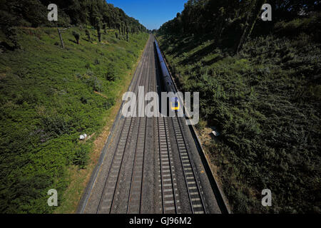 A very deep cutting for the Great Western railway built by Brunel looking eastwards showing four parallel tracks relief and main Stock Photo