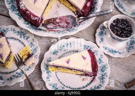 Slice of blueberry cheesecake on vintage plate Stock Photo