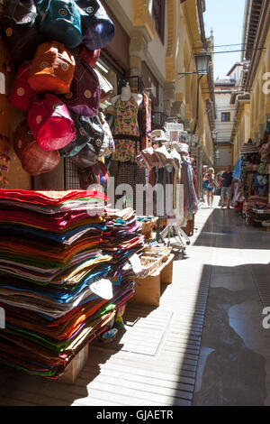 Granada, Spain - August 5, 2016: Narrow streets filled with shops called Alcaiceria, originally home to a Moorish silk market, G Stock Photo