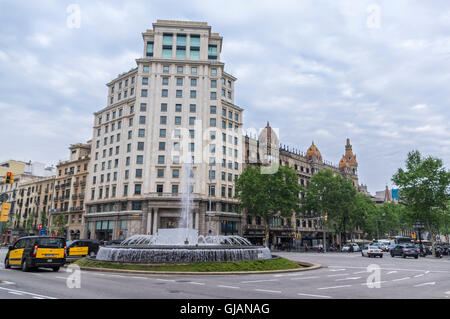 Building and fountain on Passeig de Gràcia, Barcelona, Catalonia, Spain. Stock Photo