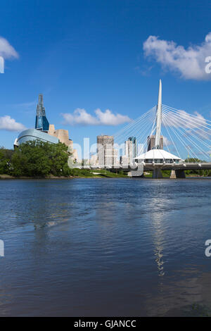 The Red River, Provencher Bridge and the city skyline of Winnipeg, Manitoba, Canada. Stock Photo