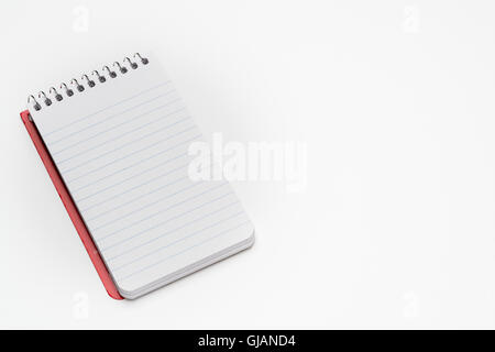 Pocket size spiral notebook on a white background Stock Photo