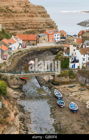 High view looking down onto Staithes Beck and the town. In Staithes, North Yorkshire, England. On Stock Photo