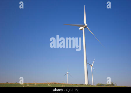 Isolated windmill in a grass field Stock Photo