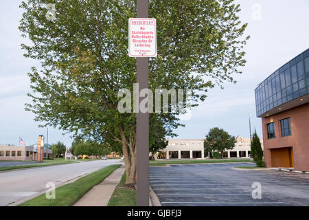 Sign prohibiting skateboards, rollerblades, bicycles and loitering. Stock Photo