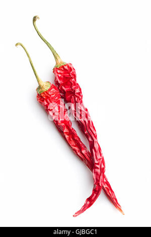 Two dried chili peppers isolated on white background. Stock Photo