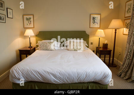 A bedroom at the Talbot Hotel in Malton, North Yorkshire, United Kingdom. The upscale hotel is in a former coaching house. Stock Photo