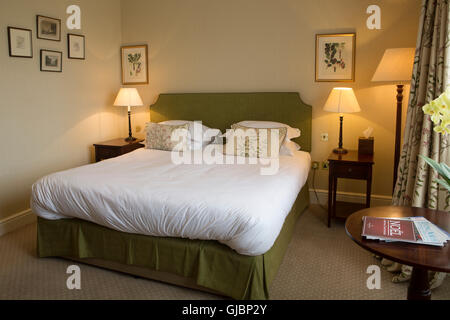 A bedroom at the Talbot Hotel in Malton, North Yorkshire, United Kingdom. The upscale hotel is in a former coaching house. Stock Photo