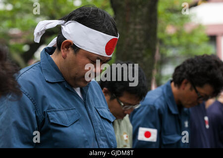 Tokyo, Japan. 15th Aug, 2016. Japanese nationalists dressed in military uniforms bow to pay their respects to the war dead at Yasukuni Shrine on the 71st anniversary of Japan's surrender in World War II on August 15, 2016, Tokyo, Japan. Some 70 lawmakers visited the Shrine to pay their respects, but the Prime Minister Shinzo Abe did not visit the controversial symbol and instead sent a ritual offering to a shrine. Credit:  Aflo Co. Ltd./Alamy Live News Stock Photo