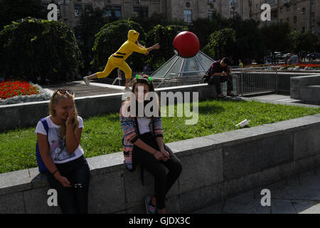 Kyiv, Ukraine. 15th Aug, 2016. Young people wearing Pokemon costumes hunt the passers-by exactly the way people hunt Pokemons playing the ''Pokemon Go'' game with their smartphones and tablets. Launched at the beginning of July by the US company Niantic, the mobile phone game 'Pokemon Go' has found a real success worldwide and already have generated more than 160 US million dollars. © Sergii Kharchenko/ZUMA Wire/Alamy Live News Stock Photo