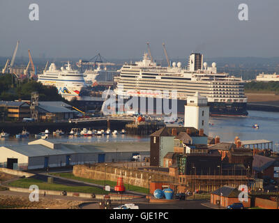 Newcastle Upon Tyne, UK. 16th August, 2016. UK Weather. A sunny and busy morning on the river Tyne as two large cruise ships, the 42289tonnes 'Aida-Vita' with the red painted lips on her bow and the 42363tonnes 'Seven Seas Voyager' cruise ships rotate there moorings at Northumberland Quay, with the 2015/16 newly built Holland/American line, the 99836tonnes Koningsdam cruise ship on what is expected to be one of the busiest days for cruise ship activity so far this year at the Port of Tyne . Credit:  james walsh/Alamy Live News Stock Photo