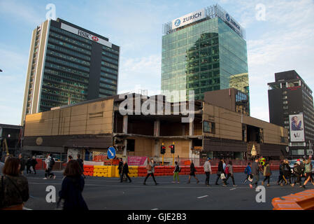 Auckland, New Zealand. 16th August, 2016. The demolition of the 1970's Downtown Shopping Centre has begun in Auckland CBD. This is clearing the way for the Commercial bay retail podium and a new 39-storey PWC office tower. Credit:  Vadim Boussenko/Alamy Live News Stock Photo