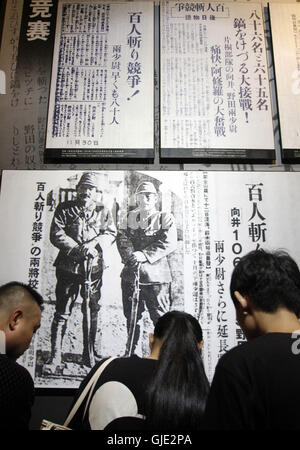 Nanjing, Nanjing, China. 16th Aug, 2016. Nanjing, CHINA - August 6 2016: (EDITORIAL USE ONLY. CHINA OUT) Visitors look at the files and ironclads of Japanese invaders' cruel massacre at Nanjing Massacre VictimsÂ¡Â¯ Memorial Hall. Tomomi Inada, who was appointed as Japanese defense minister, denied the existence of killing competition during the Nanjing Massacre that left an estimated 300,000 people dead in interviews with local media on August 4, 2016. China recently slammed the new Japanese ministerÂ¡Â¯s fault of denying the history and said that Japan should face up to the fact. (Credit I Stock Photo